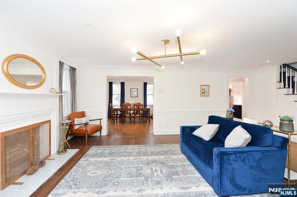 675 Center Street Oradell, NJ 07649 - Photo 12 of 29 a living room with furniture a fireplace and a flat screen tv