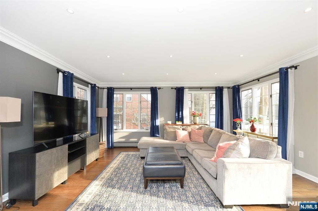 675 Center Street Oradell, NJ 07649 - Photo 13 of 29 a living room with furniture and a flat screen tv