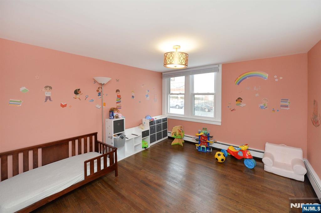 675 Center Street Oradell, NJ 07649 - Photo 15 of 29 a room with furniture and a wooden floor