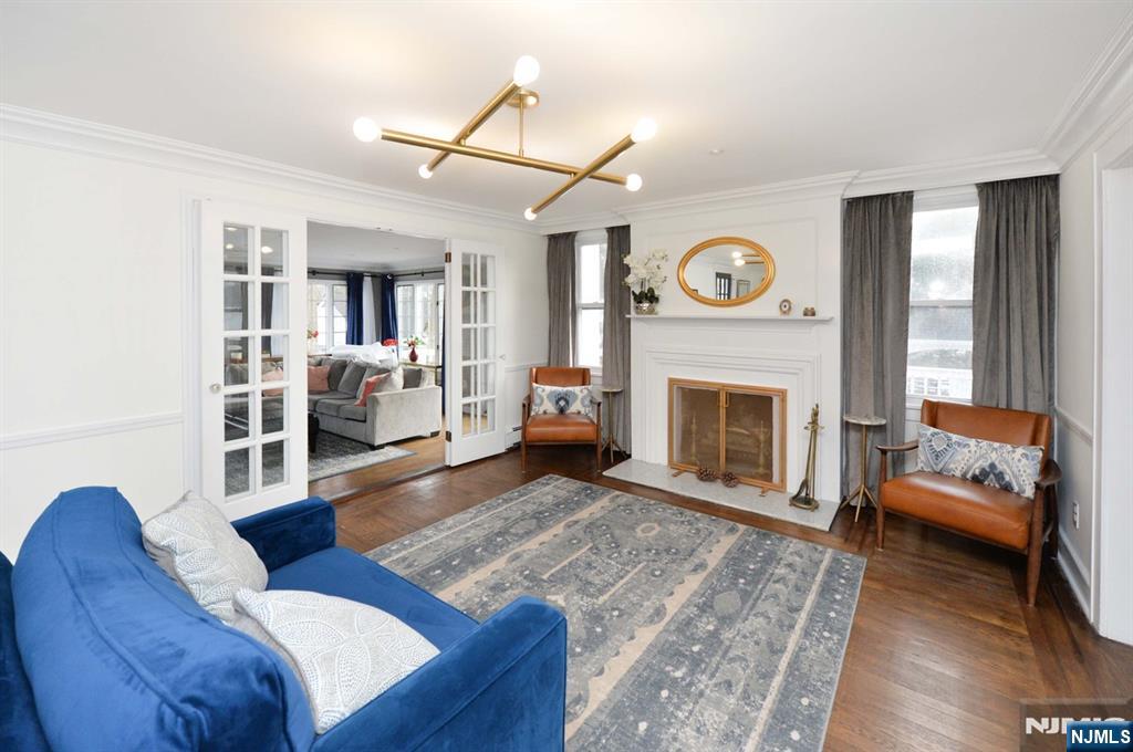 675 Center Street Oradell, NJ 07649 - Photo 10 of 29 a living room with furniture a window and a fireplace