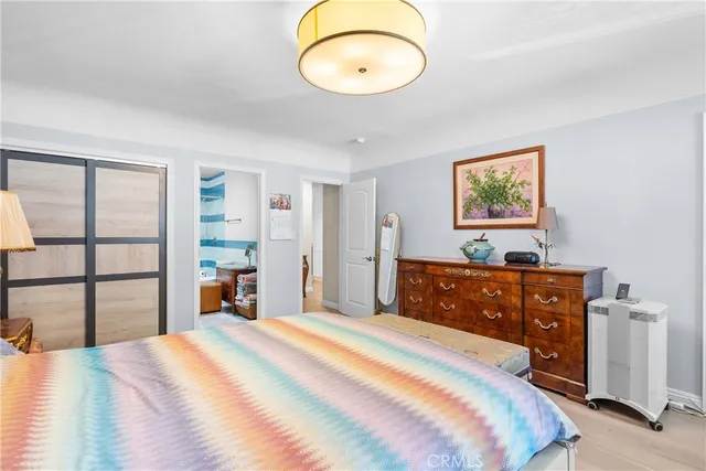 a bedroom with a bed and a cabinets