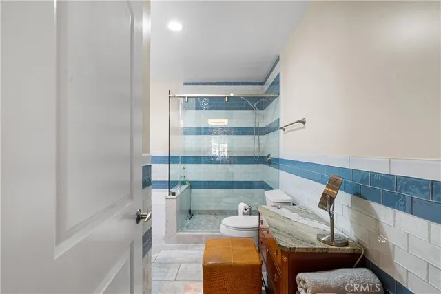 a bathroom with a bathtub and shower