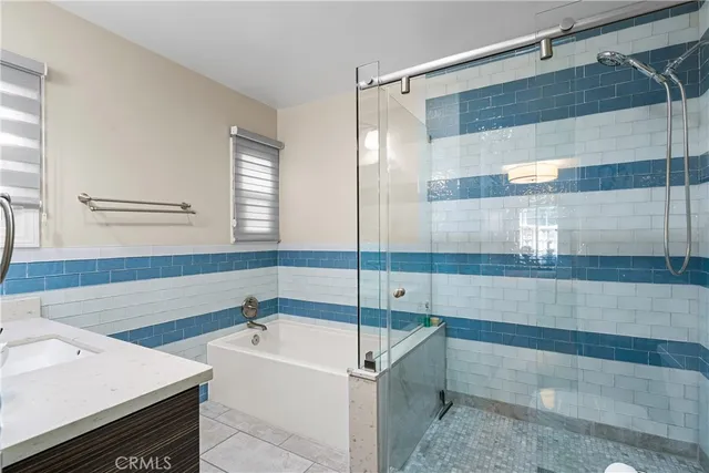 a bathroom with a bathtub and a sink