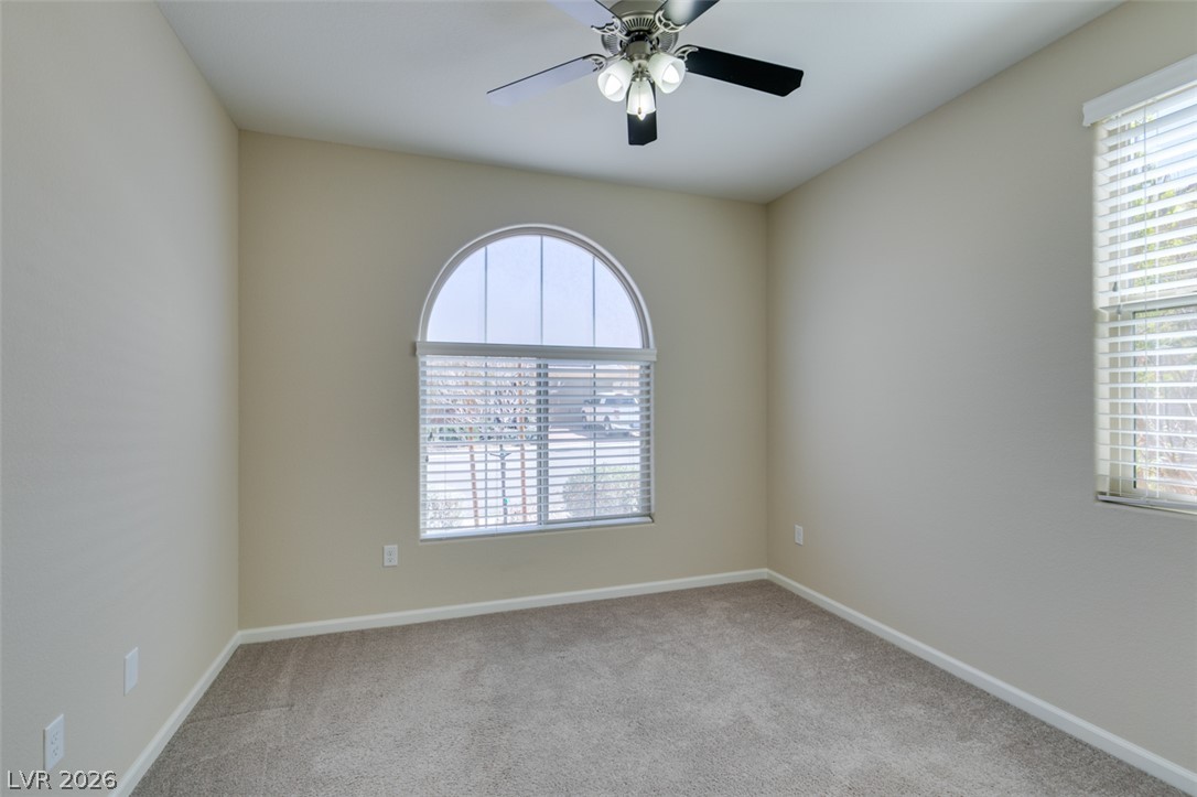 2549 Sable Ridge Street Henderson, NV 89044 - Photo 32 of 48 A versatile room provides comfort with soft carpeting and a bright arched window.