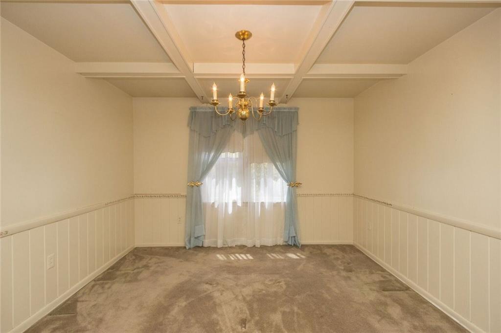 935 Chapel Road Beaver, PA 15009 - Photo 5 of 19 dining room with crown molding and beam ceiling