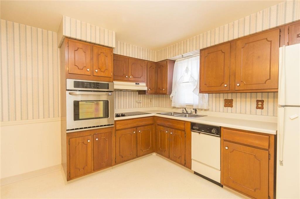 935 Chapel Road Beaver, PA 15009 - Photo 7 of 19 built in oven range, electric stove, and refrigerator