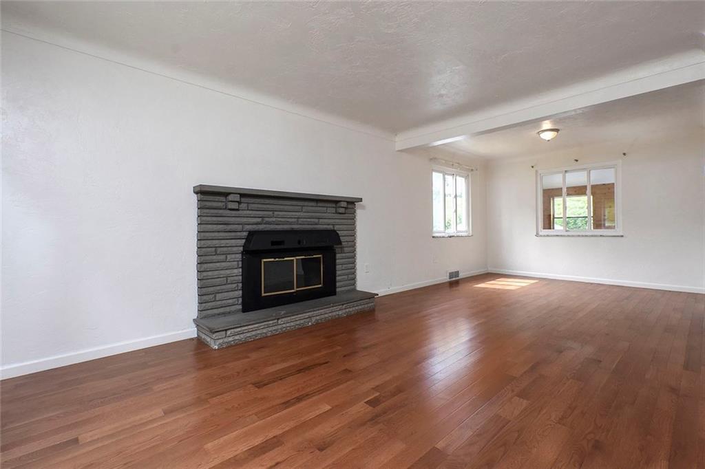 1009 Arona Road New Stanton, PA 15672 - Photo 4 of 24 This living room/dining room combination is nice for the new open floor plans everyone is coveting these days. Refinished hardwood and fireplace will make this a beautiful entrance into your new home!