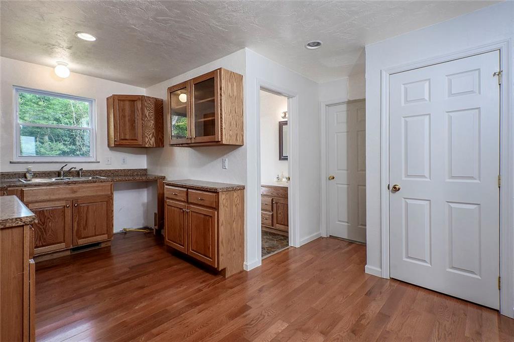 1009 Arona Road New Stanton, PA 15672 - Photo 7 of 24 Another view of the kitchen. There is space for a dishwasher too! Door to basement and master bedroom on the right.