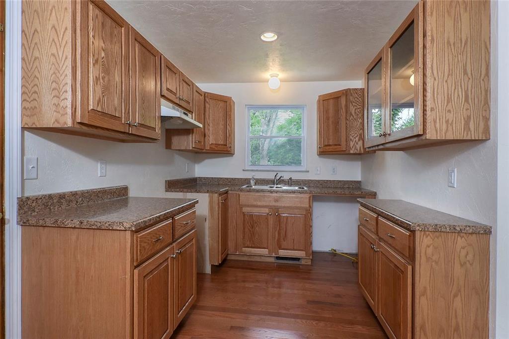 1009 Arona Road New Stanton, PA 15672 - Photo 8 of 24 Close up view of the kitchen. Notice the glass cabinet doors.