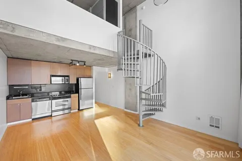 a view of kitchen with sink and stainless steel appliances