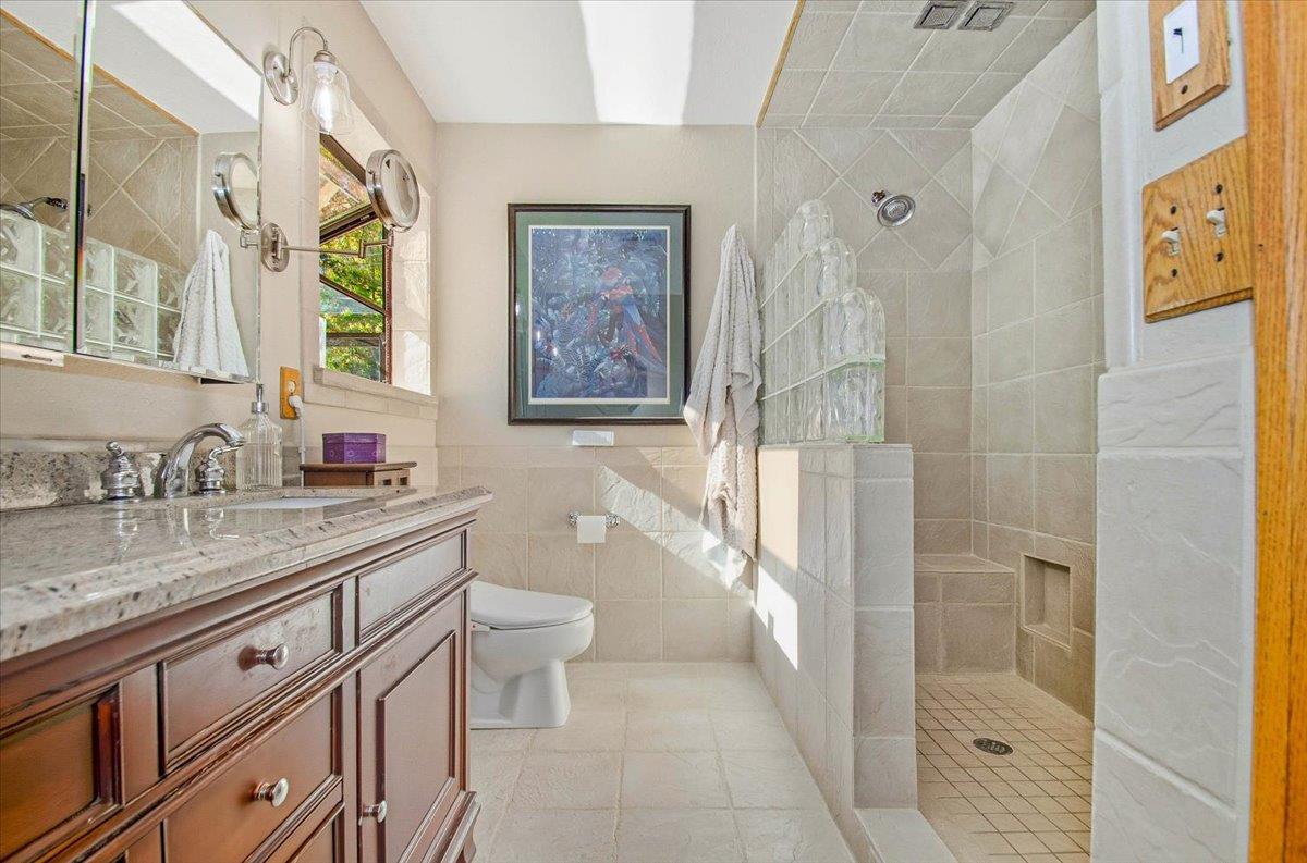 5617 Indian Hills Road Murphys, CA 95247 - Photo 16 of 80 a bathroom with a granite countertop sink toilet and shower