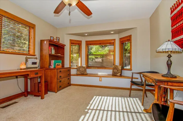 a bedroom with two beds and a chandelier