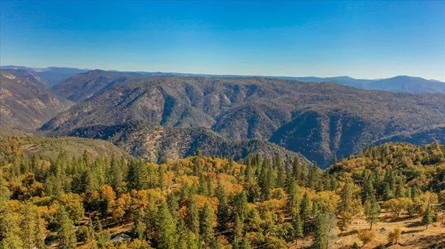 a view of a chairs and fire pit in the patio