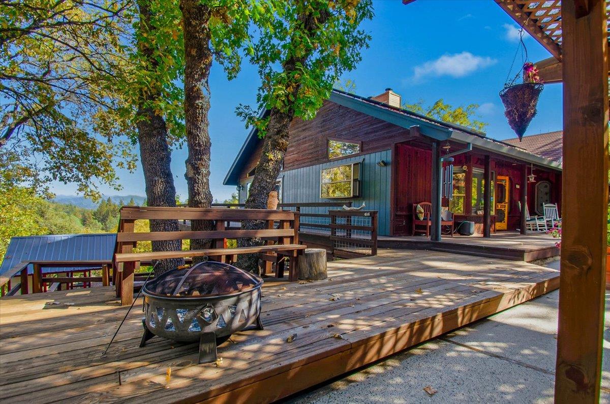 5617 Indian Hills Road Murphys, CA 95247 - Photo 3 of 80 a view of a chairs and fire pit in the patio
