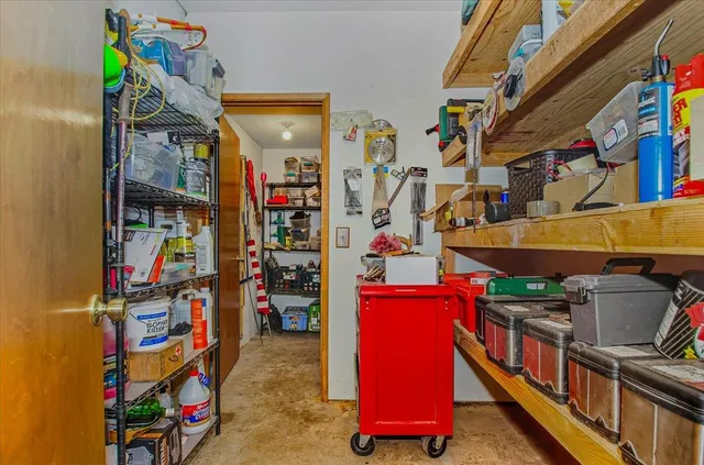 a kitchen with stainless steel appliances granite countertop a refrigerator a sink dishwasher a stove and a refrigerator with wooden floor