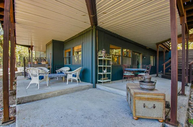 a bedroom with furniture and a window