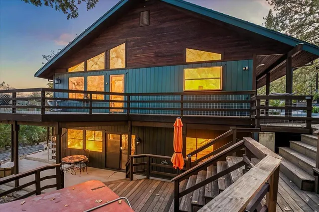 a bathroom with a granite countertop shower a sink and a mirror