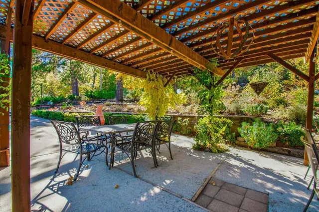 a living room with furniture a flat screen tv and a window