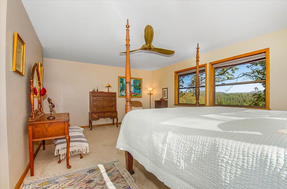 5617 Indian Hills Road Murphys, CA 95247 - Photo 49 of 80 a bedroom with furniture and a window