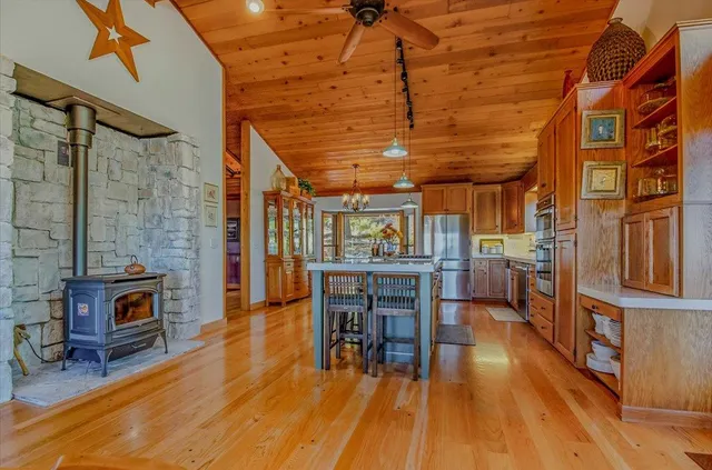 a kitchen with stainless steel appliances granite countertop a stove and refrigerator