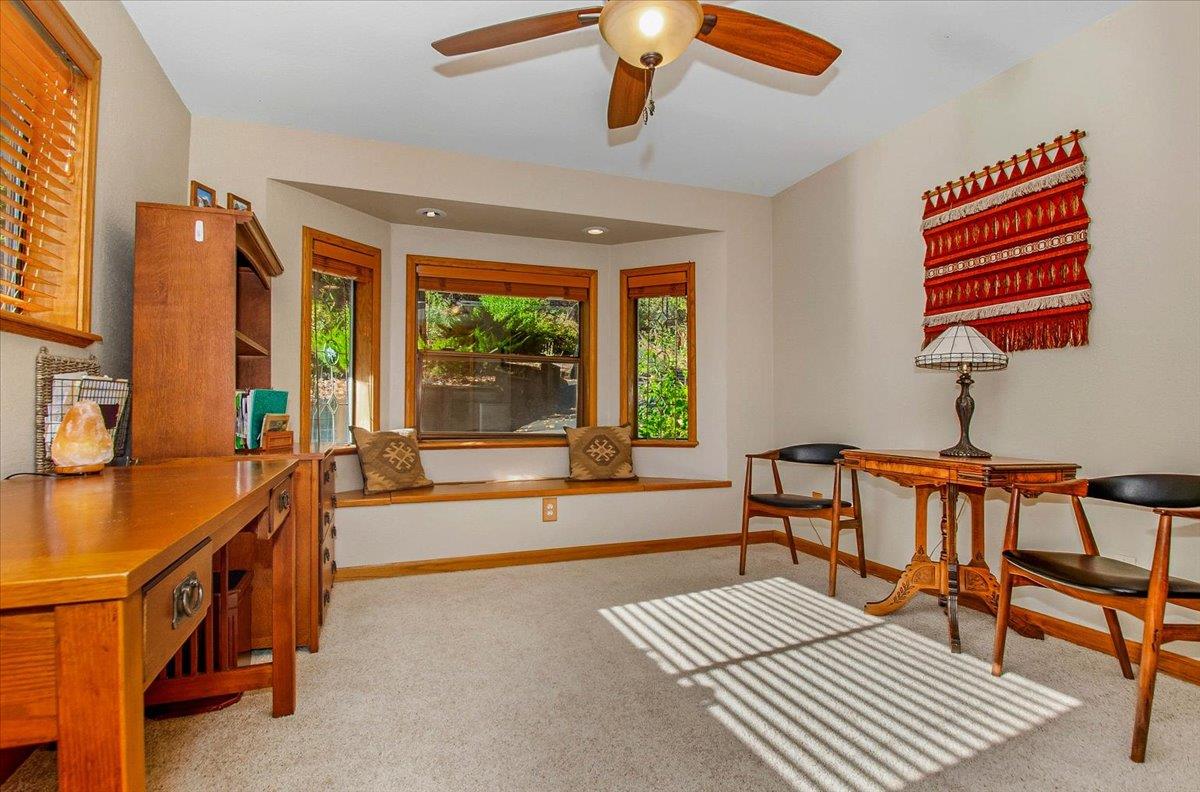 5617 Indian Hills Road Murphys, CA 95247 - Photo 54 of 80 a living room with furniture a flat screen tv and a window