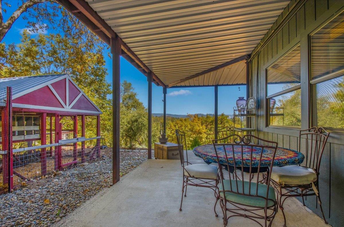 5617 Indian Hills Road Murphys, CA 95247 - Photo 55 of 80 a view of a chairs and table in the patio