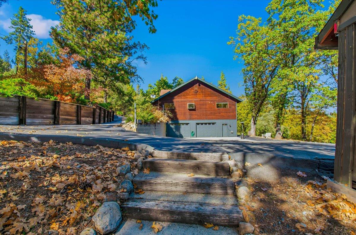 5617 Indian Hills Road Murphys, CA 95247 - Photo 68 of 80 a front view of a house with a yard