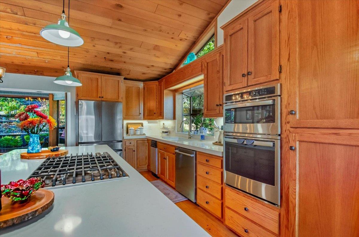 5617 Indian Hills Road Murphys, CA 95247 - Photo 7 of 80 a kitchen with stainless steel appliances granite countertop a stove and refrigerator