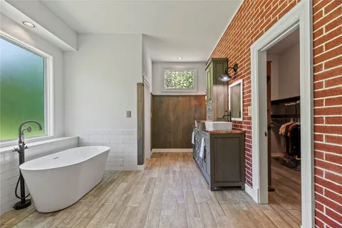 a bathroom with a bathtub and shower