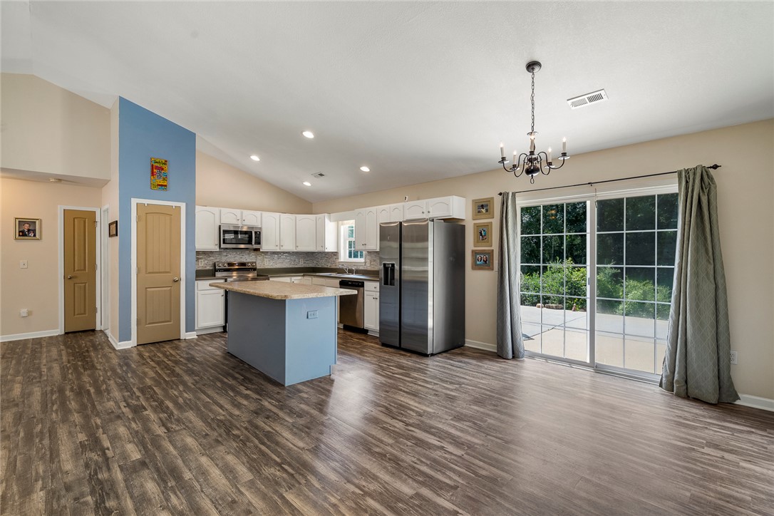 167 Mediterranean Avenue Anderson, SC 29621 - Photo 10 of 33 An open-concept great room and kitchen flow effortlessly with elegant wood flooring and vaulted ceilings.