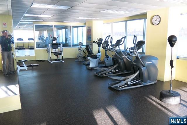 116 The Promenade, Unit 116 Edgewater, NJ 07020 - Photo 19 of 26 a view of a room with gym equipment