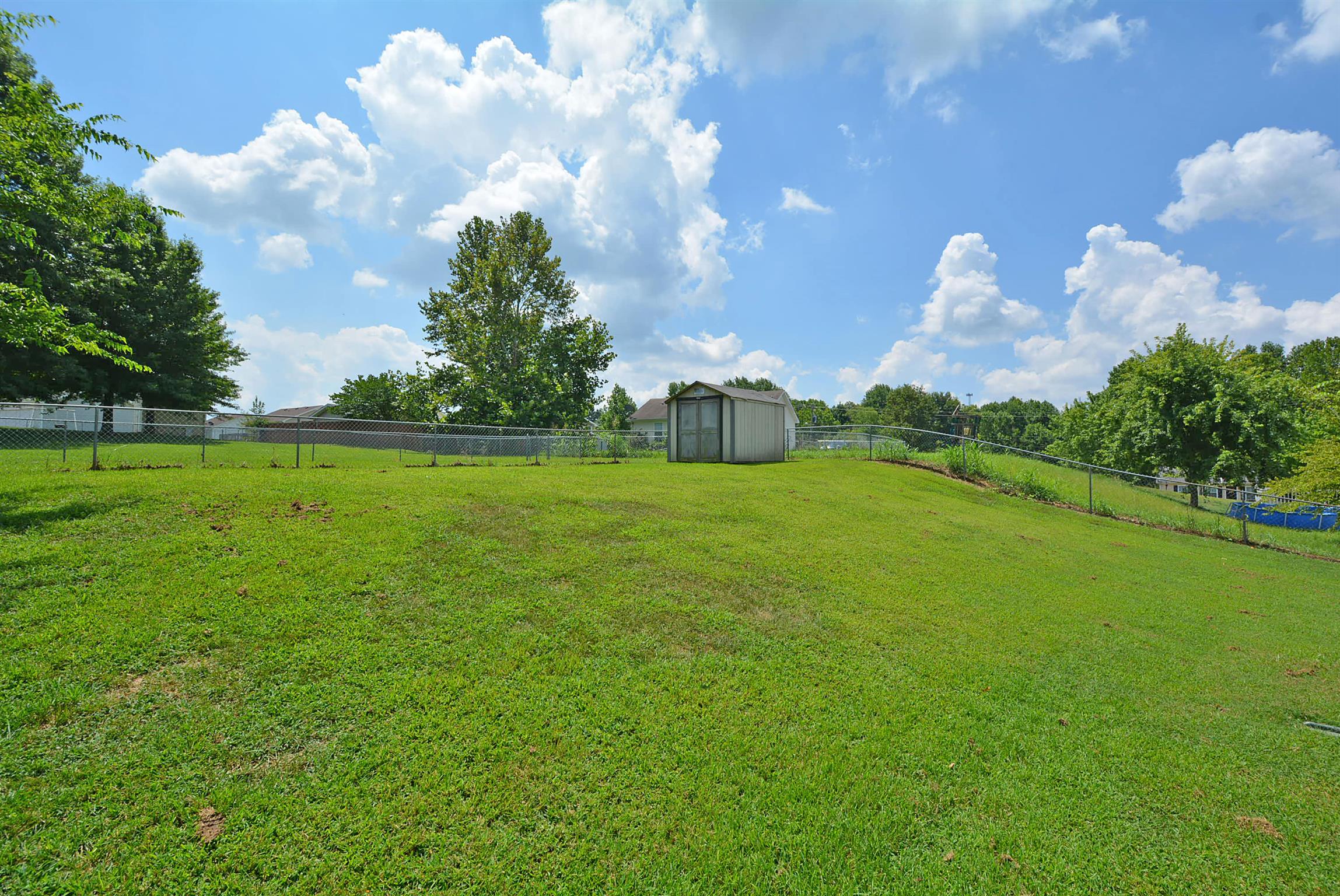 2795 Rome Lane Clarksville, TN 37040 - Photo 8 of 8 a backyard of a house with lots of green space