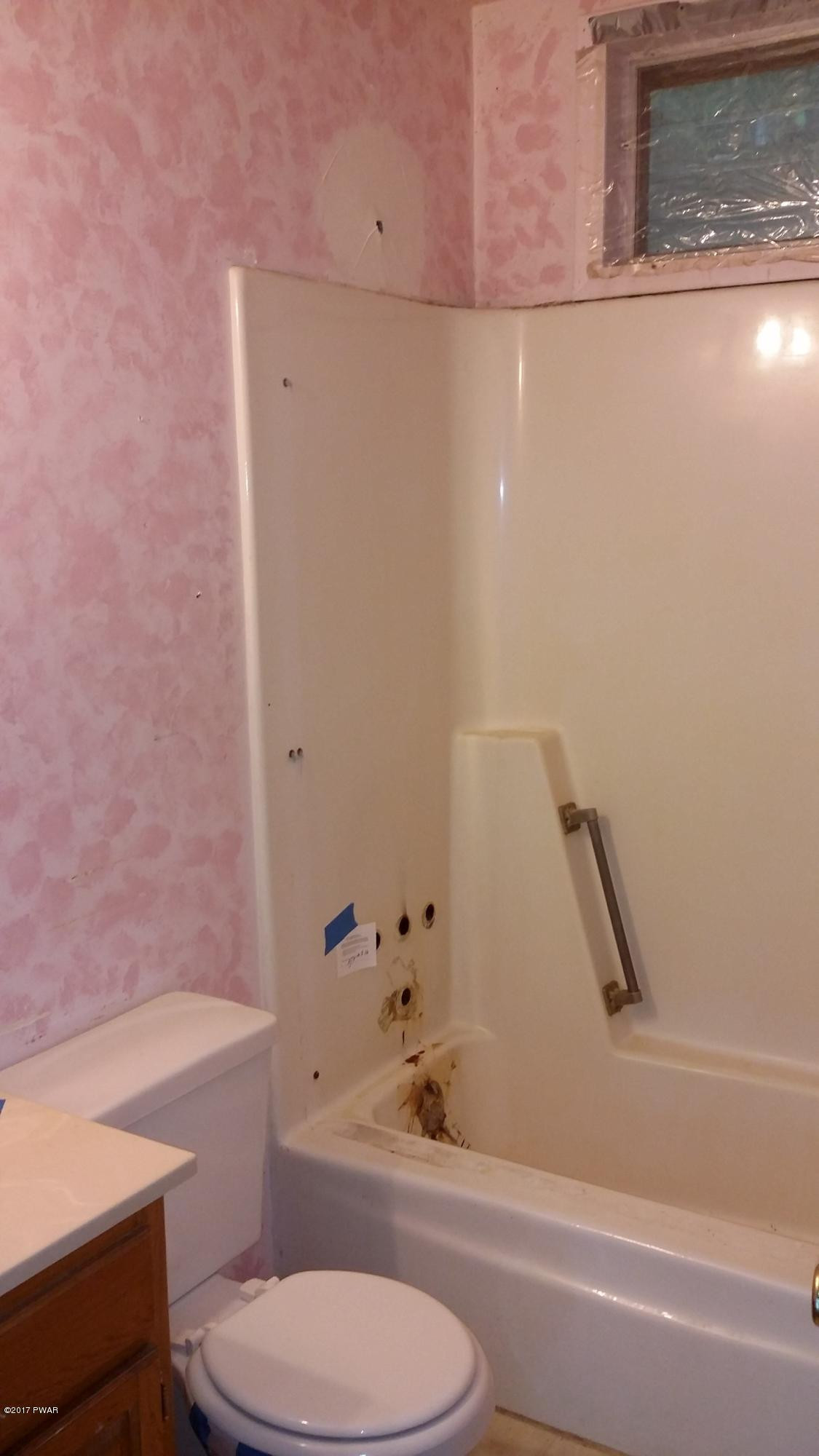 2173 Milford Road Bushkill, PA 18324 - Photo 13 of 17 a bathroom with a toilet and a tub