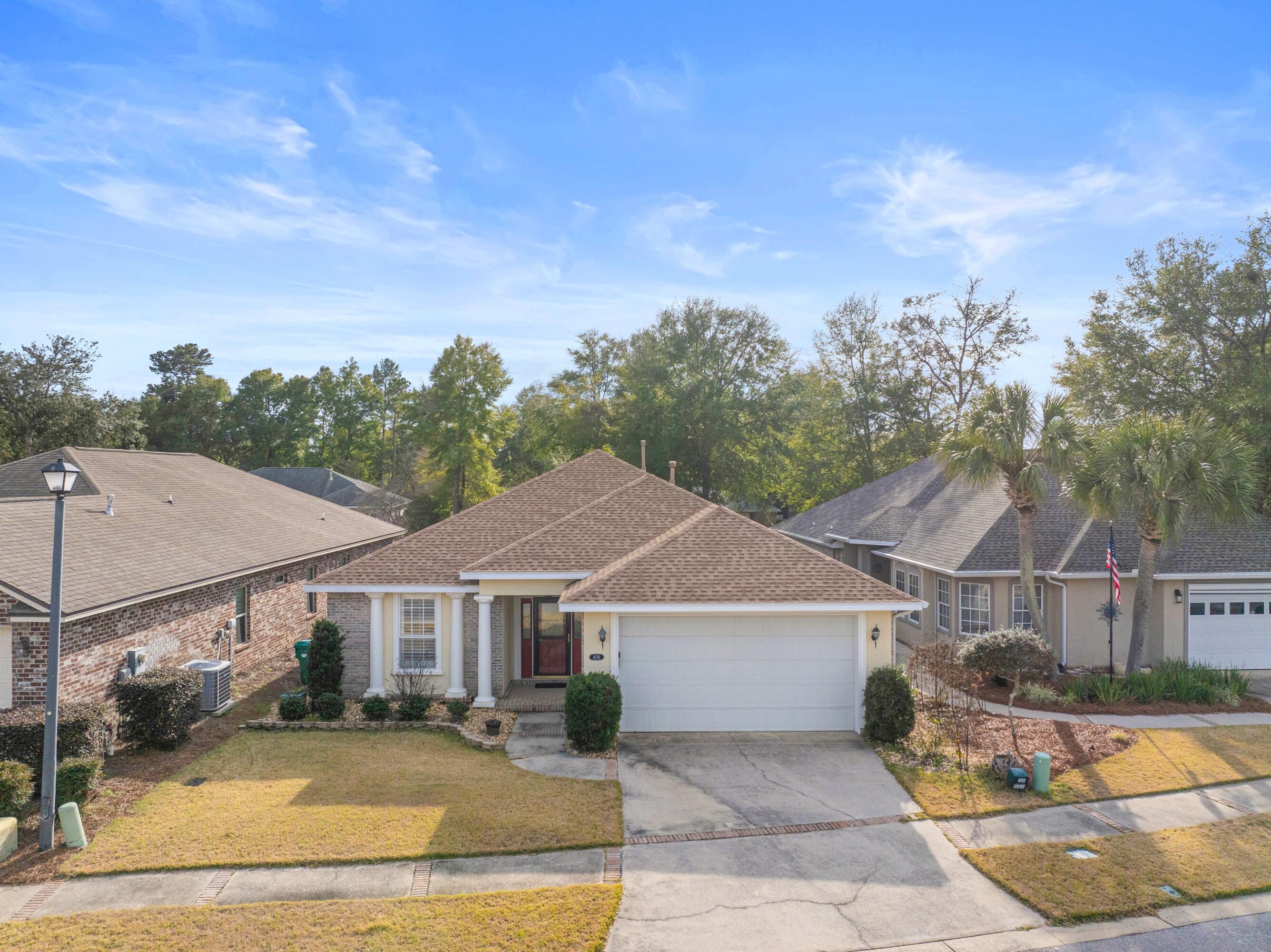 4116 Callaway Drive Niceville, FL 32578 - Photo 11 of 53 a front view of a house with a yard