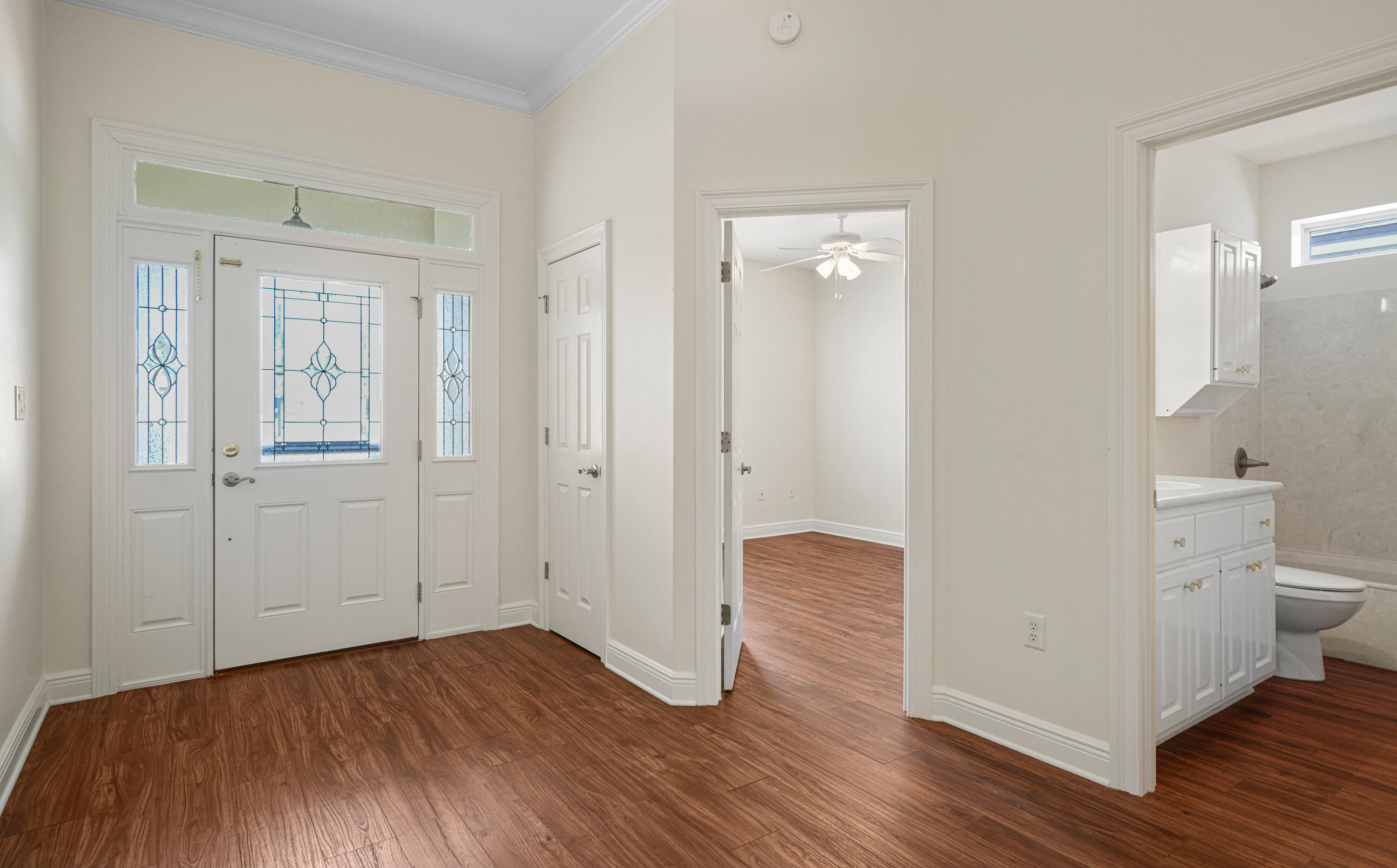 4116 Callaway Drive Niceville, FL 32578 - Photo 12 of 53 wooden floor in an empty room and a bathroom