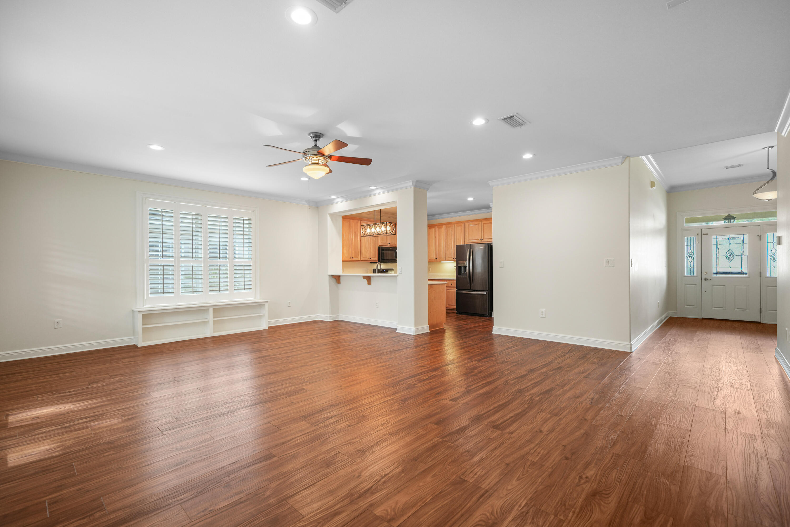 4116 Callaway Drive Niceville, FL 32578 - Photo 13 of 53 a view of an empty room with wooden floor and a window