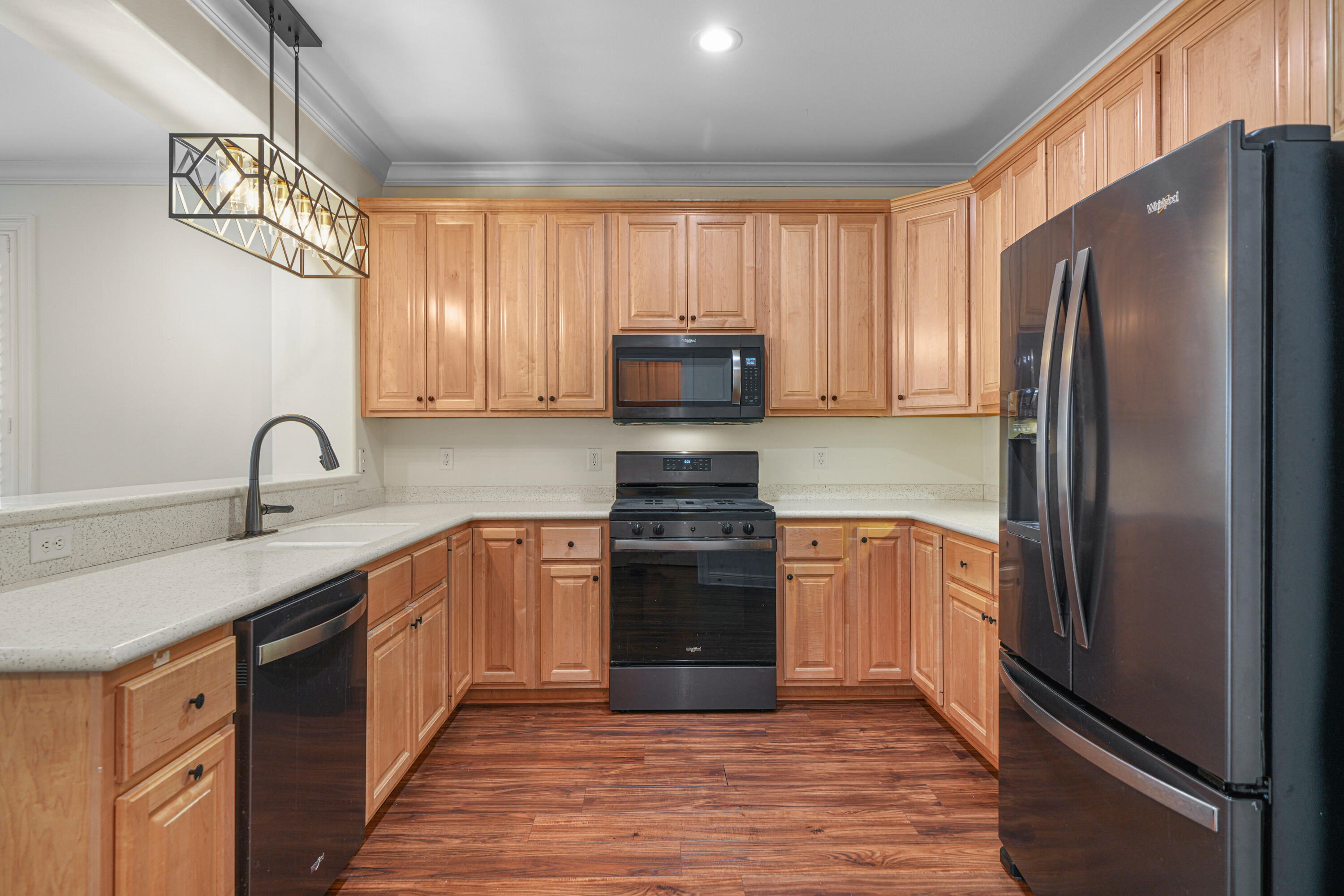 4116 Callaway Drive Niceville, FL 32578 - Photo 21 of 53 a kitchen with stainless steel appliances granite countertop a refrigerator stove and sink