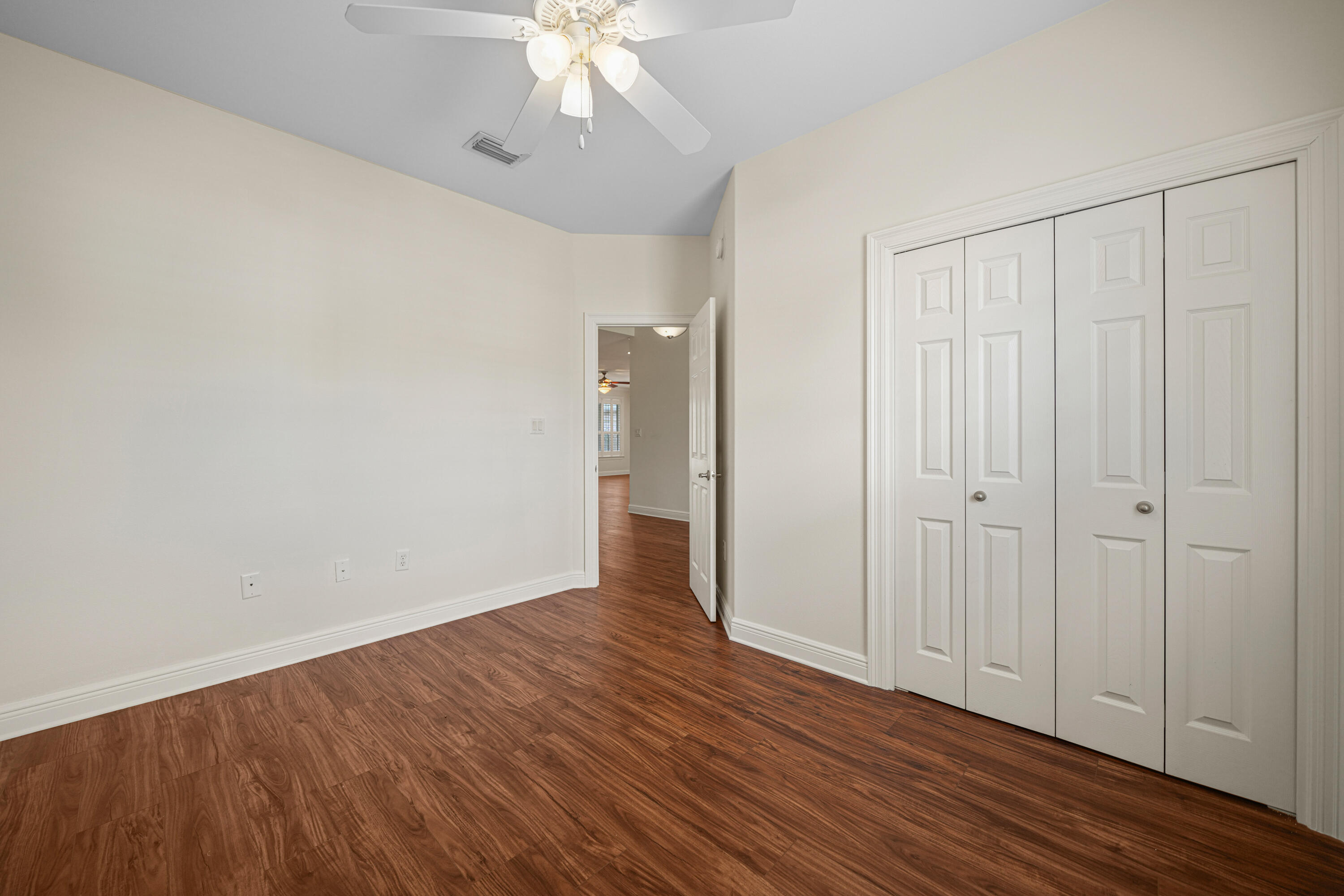 4116 Callaway Drive Niceville, FL 32578 - Photo 35 of 53 a view of an empty room with wooden floor