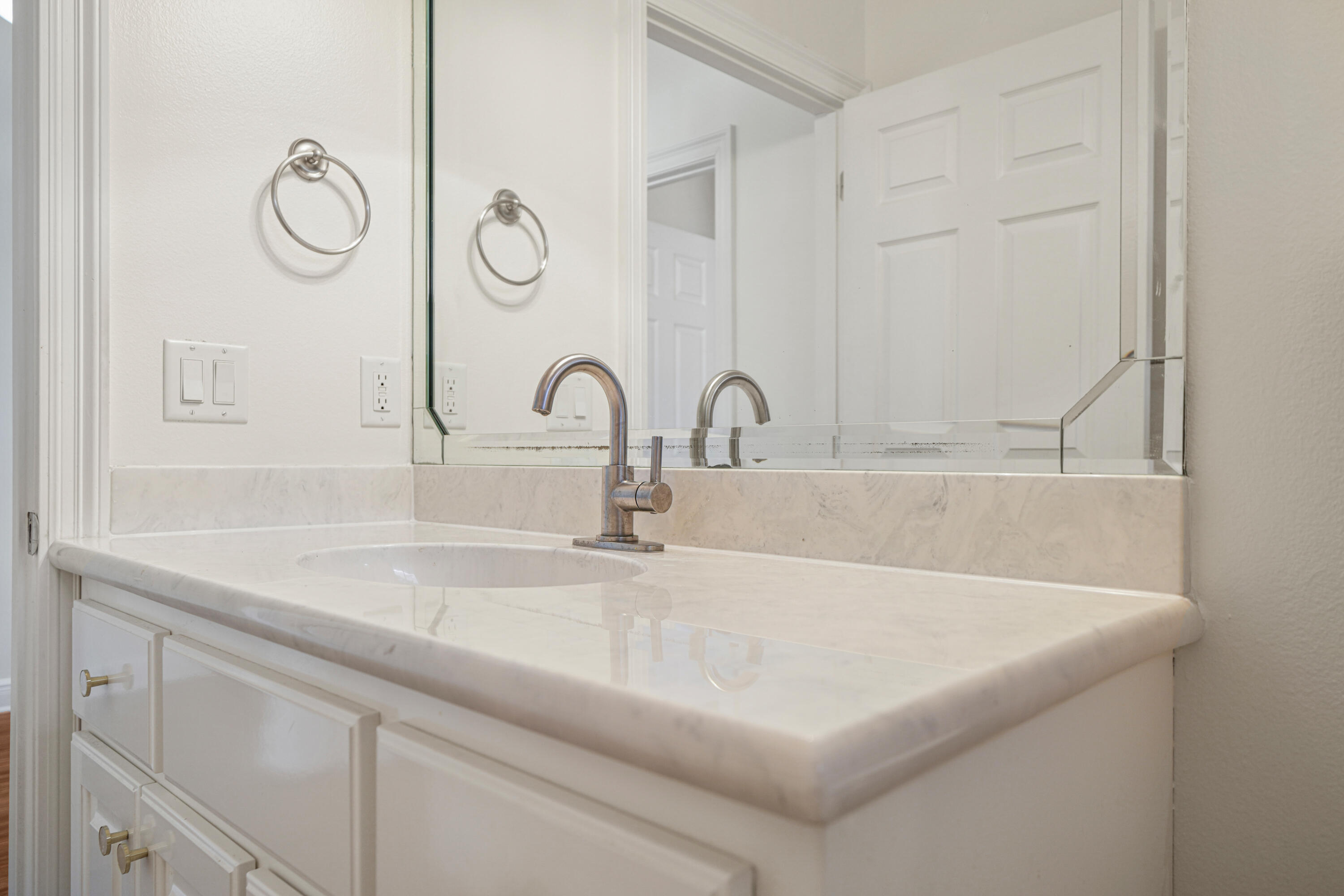 4116 Callaway Drive Niceville, FL 32578 - Photo 40 of 53 a close view of a sink a mirror and shower in it