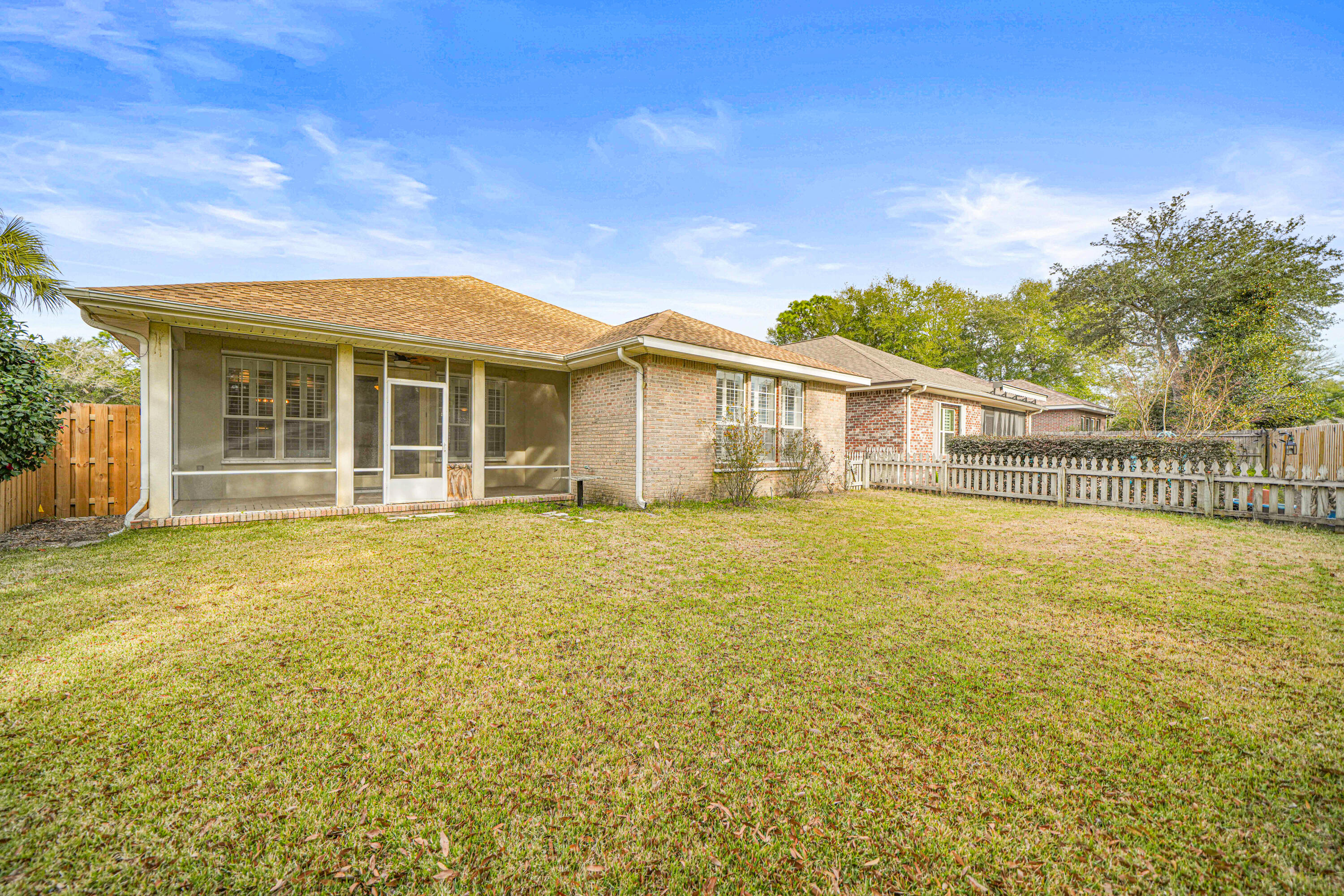4116 Callaway Drive Niceville, FL 32578 - Photo 5 of 53 a view of a house with a swimming pool and a yard