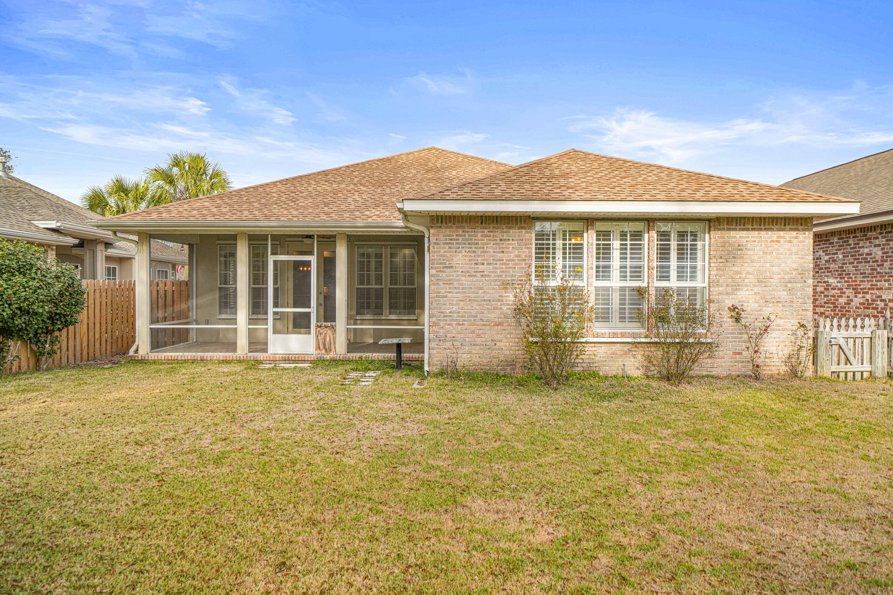 4116 Callaway Drive Niceville, FL 32578 - Photo 7 of 53 a front view of a house with a garden
