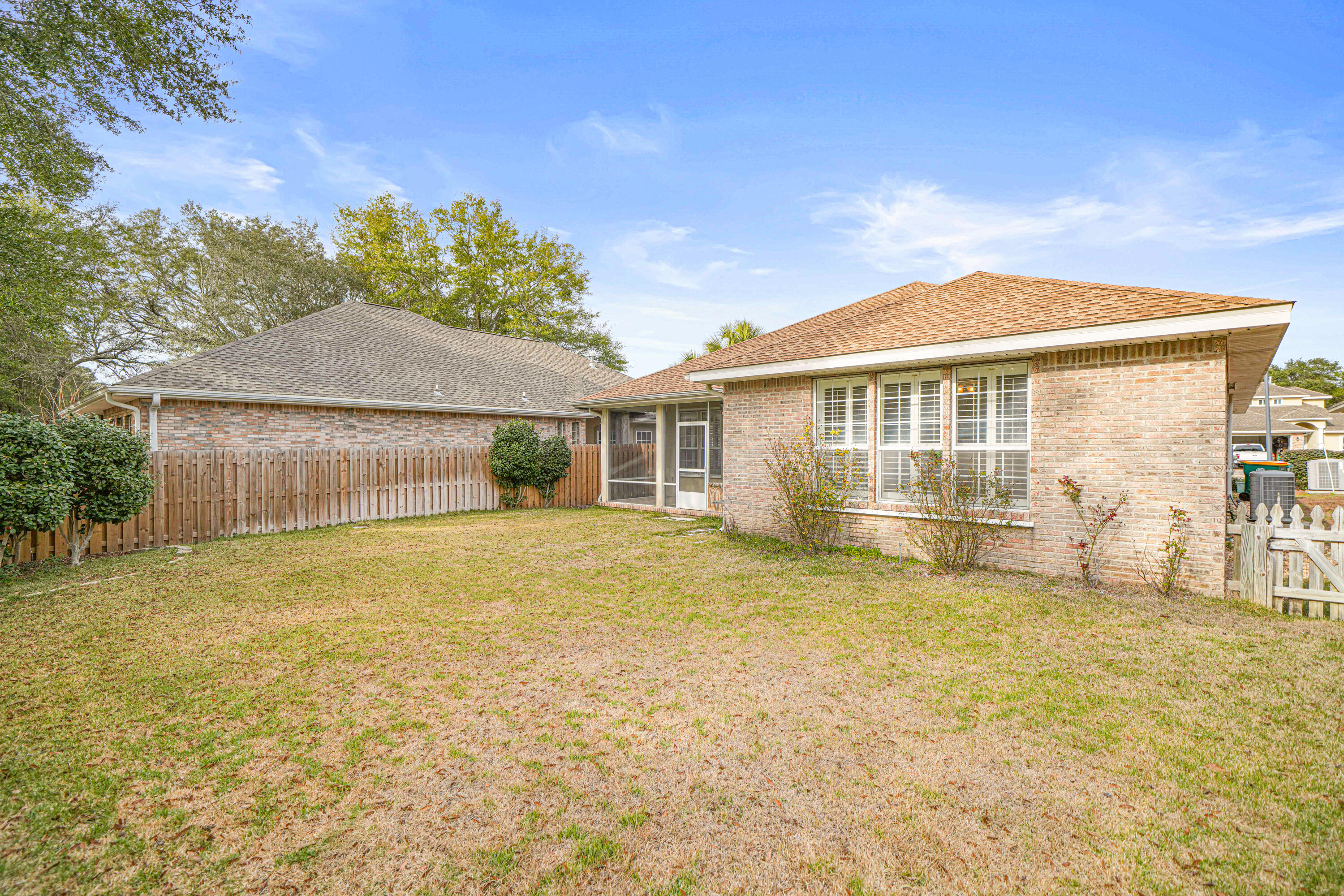 4116 Callaway Drive Niceville, FL 32578 - Photo 8 of 53 a front view of a house with a garden