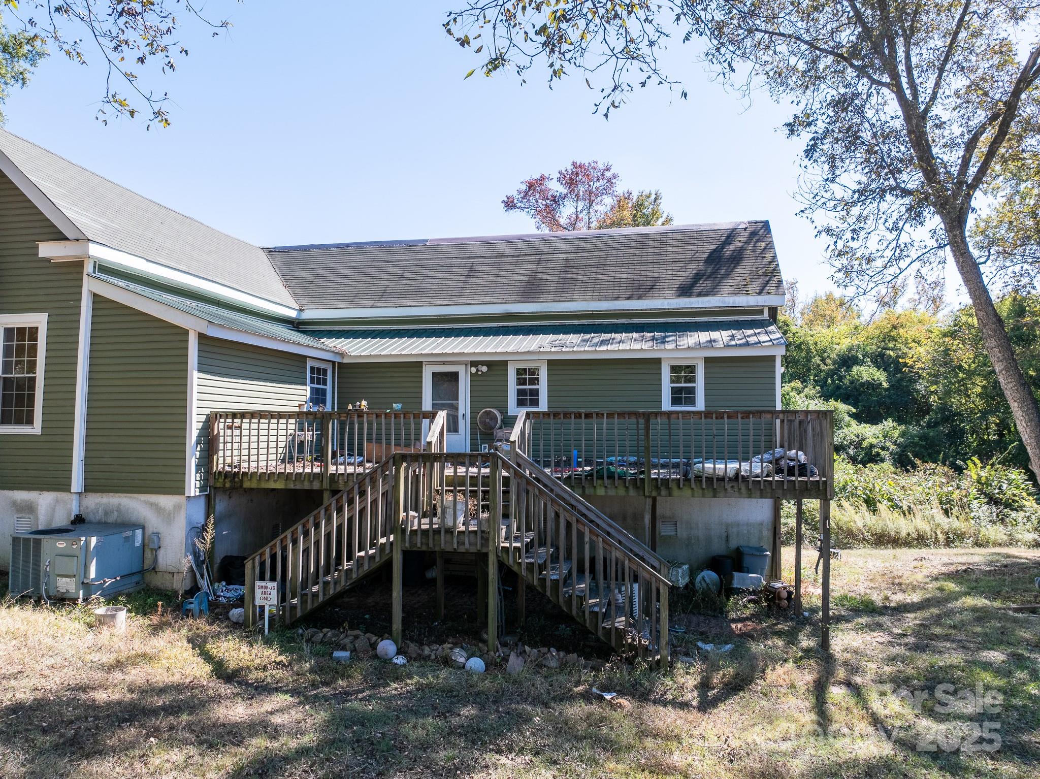 3062 Michelle Drive Blackstock, SC 29014 - Photo 18 of 23 a view of a house with a wooden deck and furniture