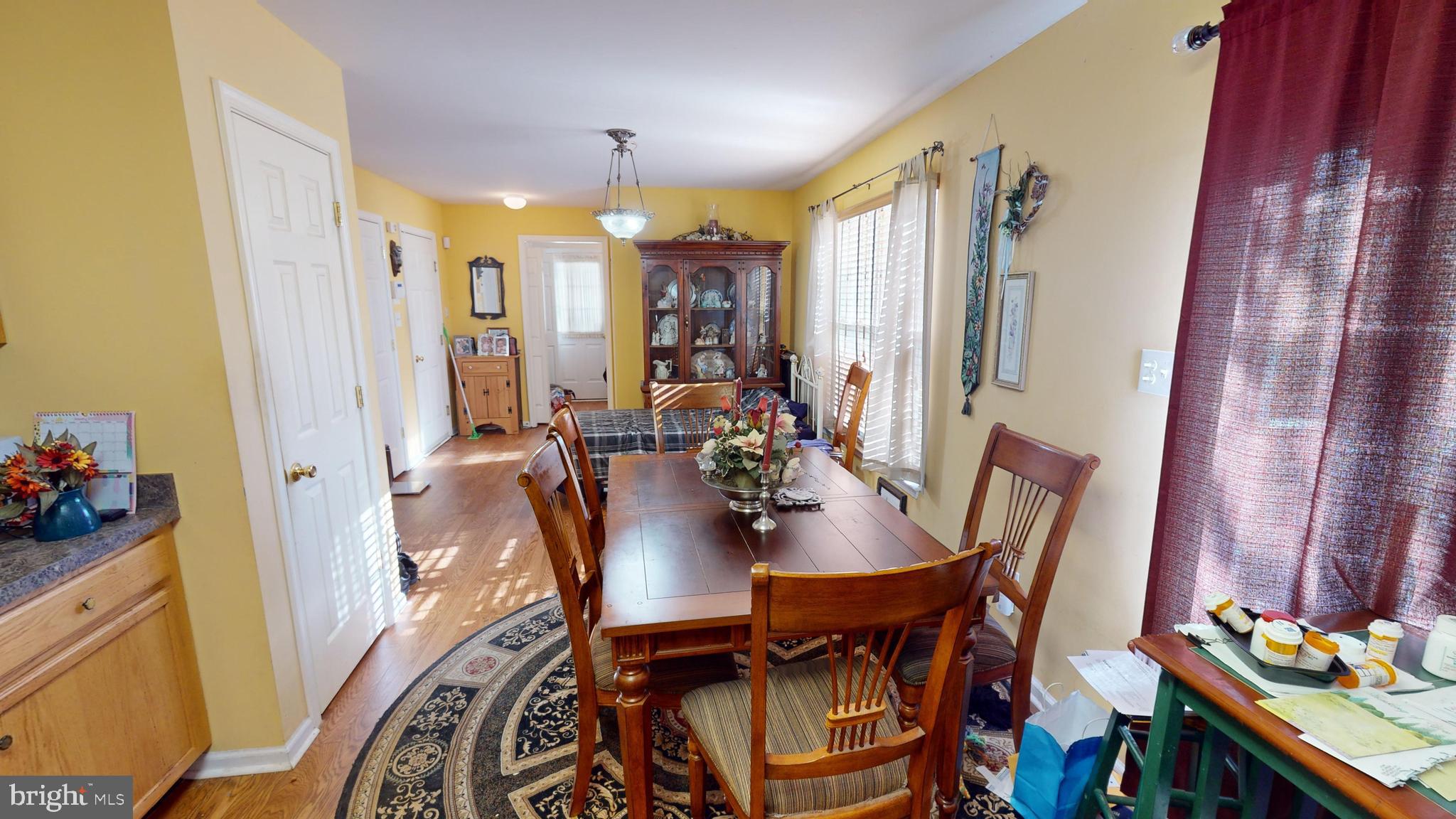 2013 Good Intent Road Woodbury, NJ 08096 - Photo 7 of 28 a view of a dining room with furniture window and wooden floor