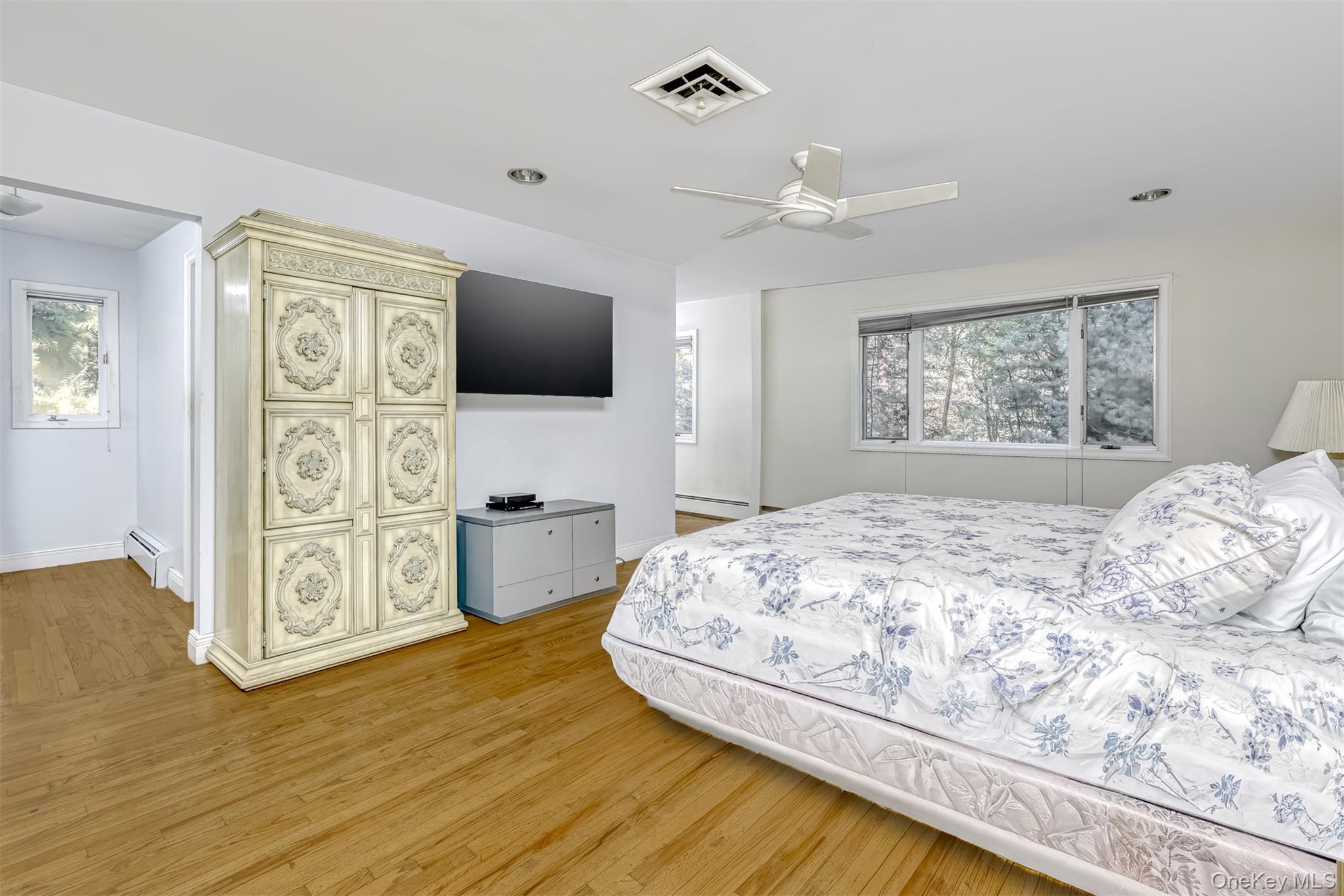 8 Kings Gate Road Suffern, NY 10901 - Photo 13 of 23 a bedroom with a bed and a flat screen tv