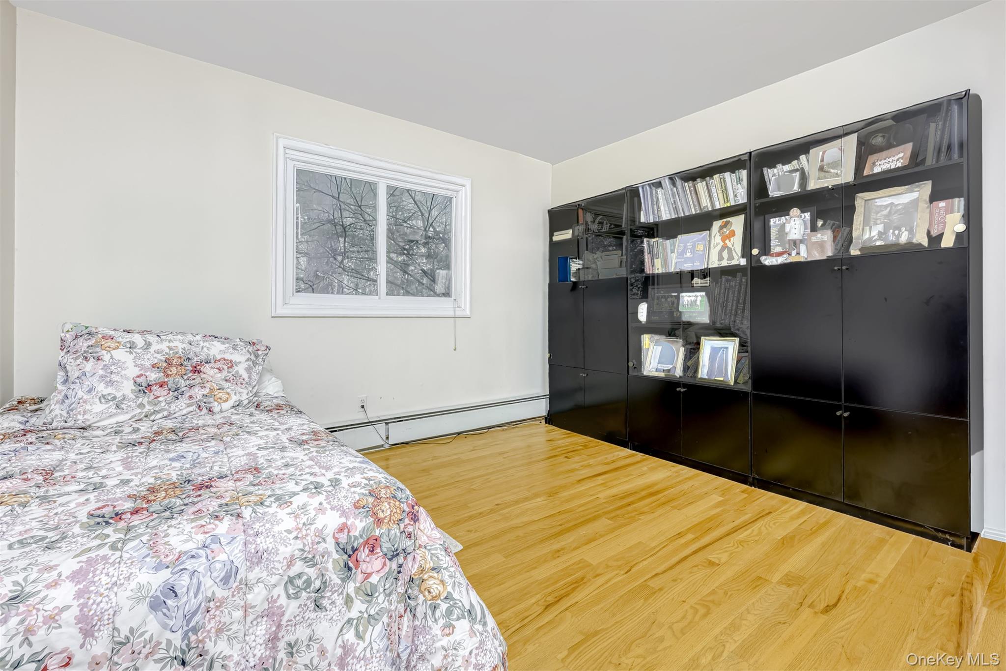 8 Kings Gate Road Suffern, NY 10901 - Photo 15 of 23 a bedroom with a large bed and a window