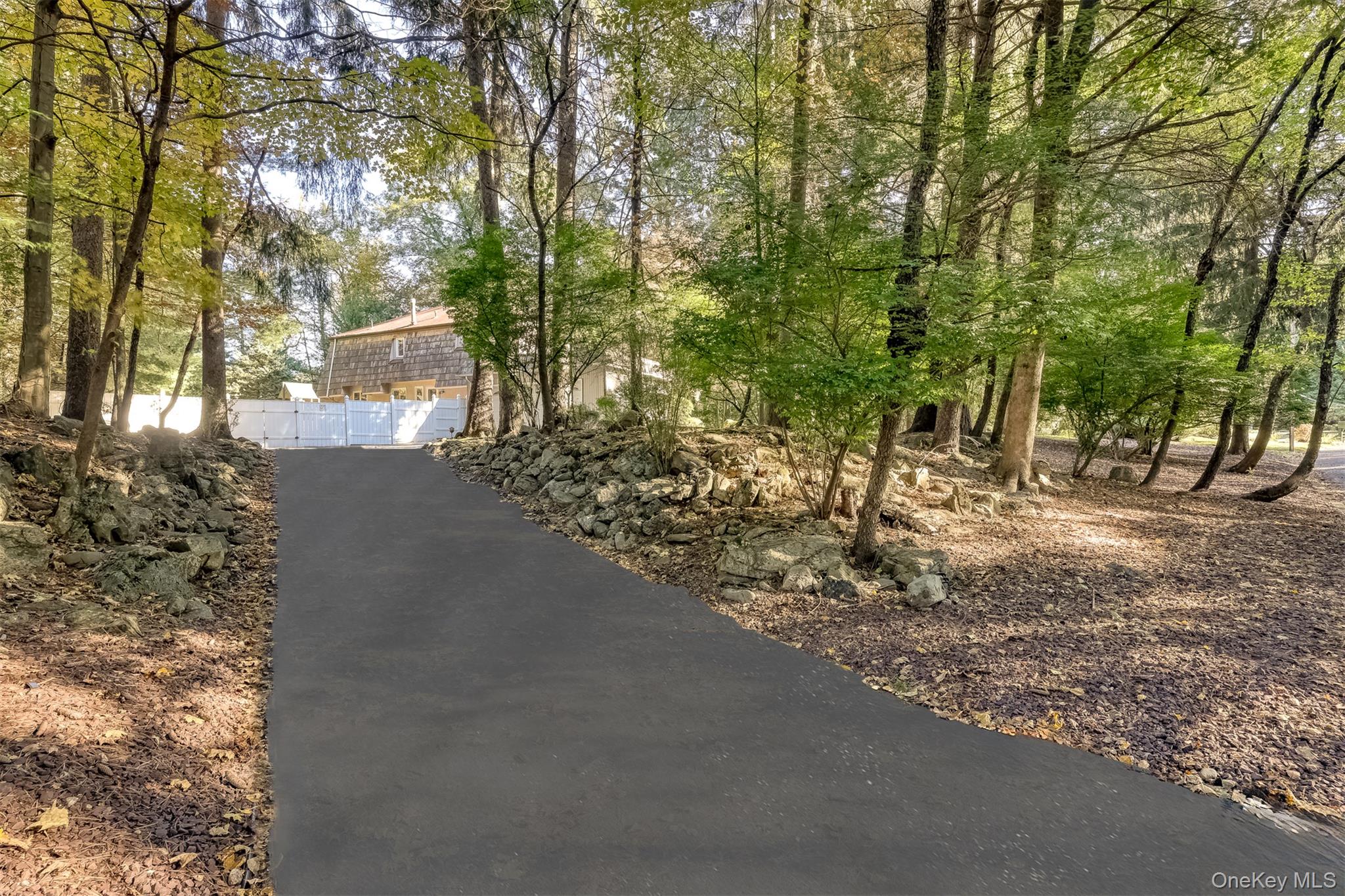 8 Kings Gate Road Suffern, NY 10901 - Photo 2 of 23 a view of a forest with trees