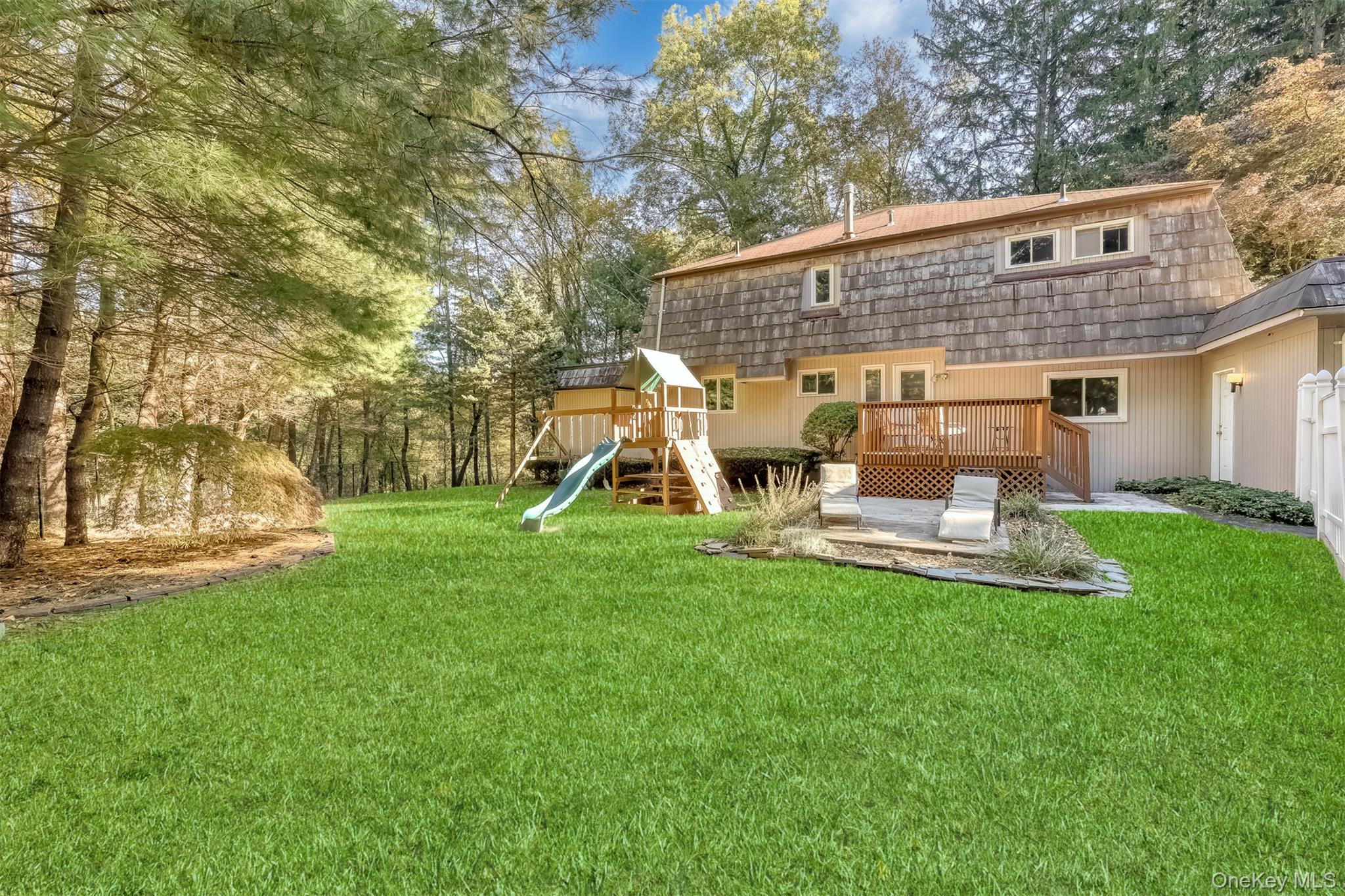 8 Kings Gate Road Suffern, NY 10901 - Photo 21 of 23 a view of a house with backyard and a slide