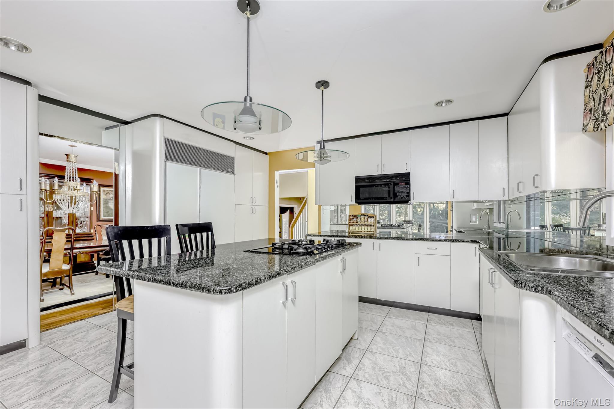 8 Kings Gate Road Suffern, NY 10901 - Photo 7 of 23 a kitchen with granite countertop a sink a counter top space appliances and cabinets