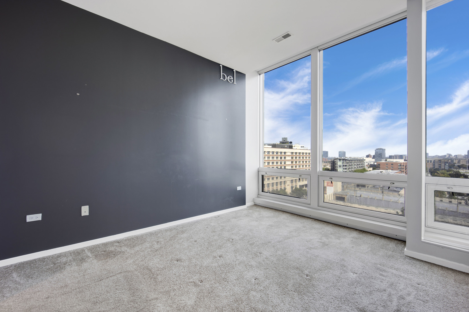 Undisclosed Address Chicago, IL 60654 - Photo 11 of 22 an empty room with large windows